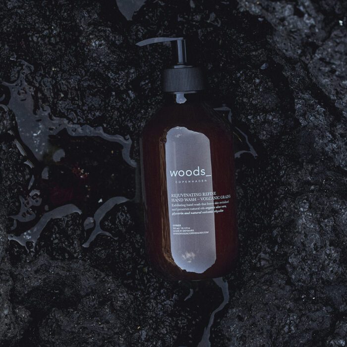 Woods Copenhagen Volcanic Grains Hand Wash - Exfoliating hand wash with volcanic rhyolite micro grains. Fresh mint scent.